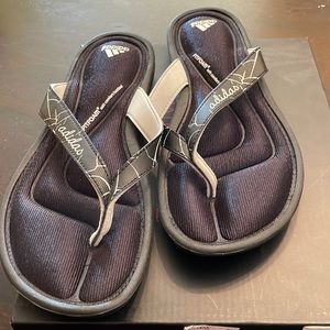 Adidas flip flops new.  Never worn black in color